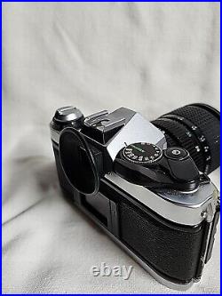 Canon AE-1 Program 35mm SLR Film Camera with 70 mm lens, Flashes, Bag & Accessor