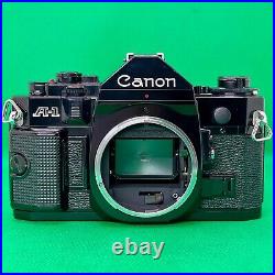 NEAR MINT Canon A-1 SLR Film Camera with lens FD 50mm F/1.4 S. S. C. Japan B002